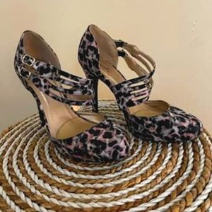 Heels newly used, size 7 pink and  black (leopard style)